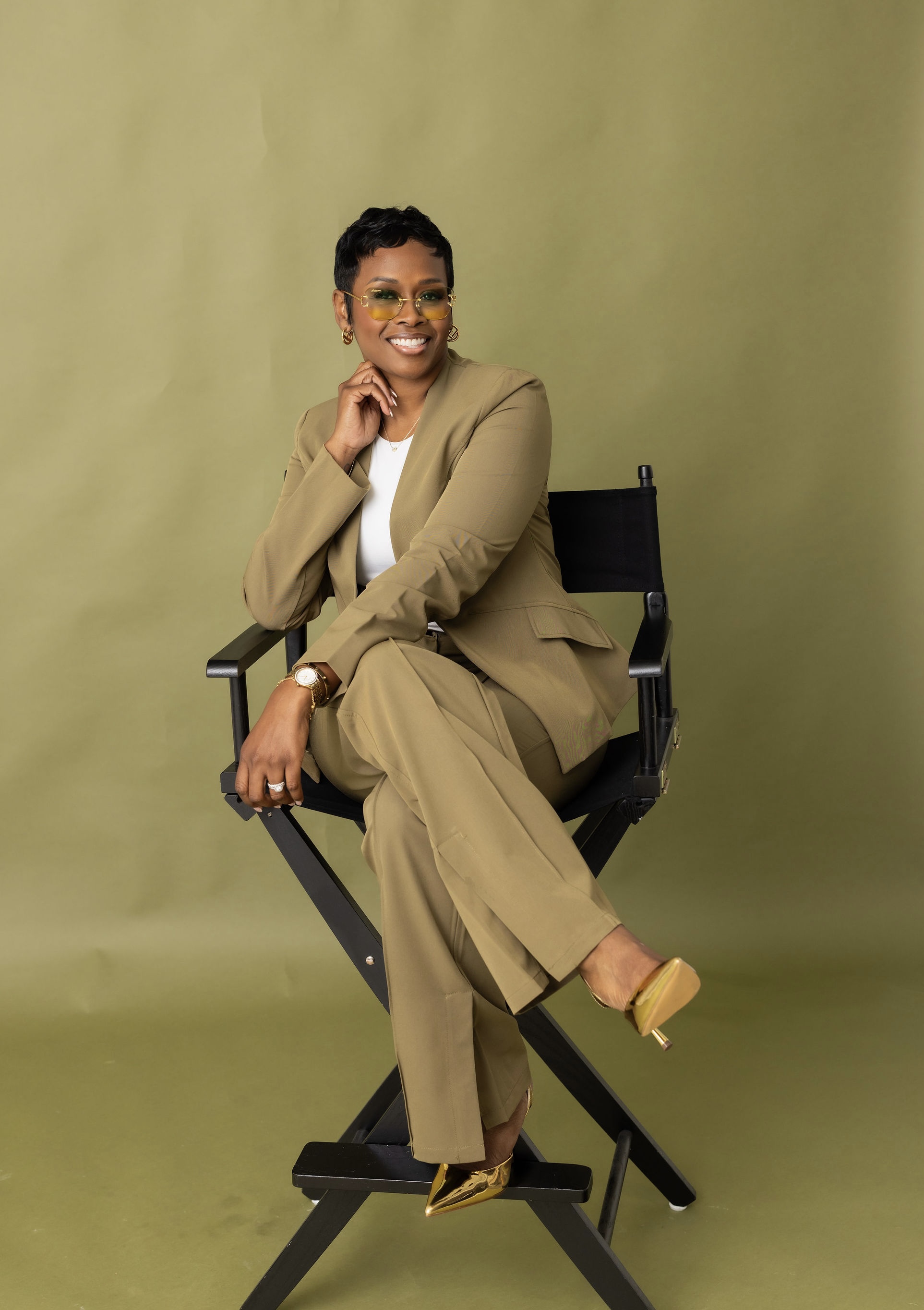 Autumn R. Russell seated in a director's chair
